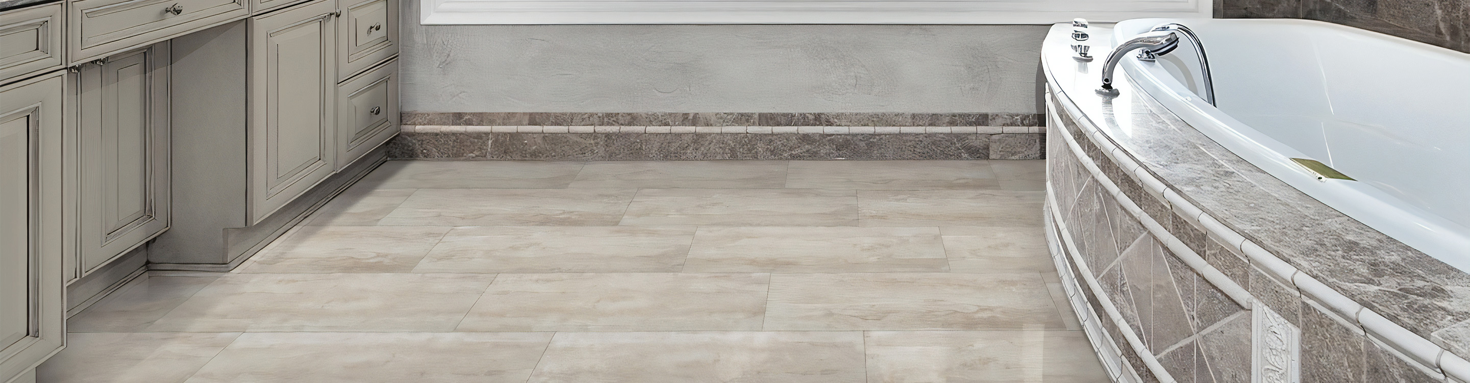 light tile flooring in a bathroom with a large window