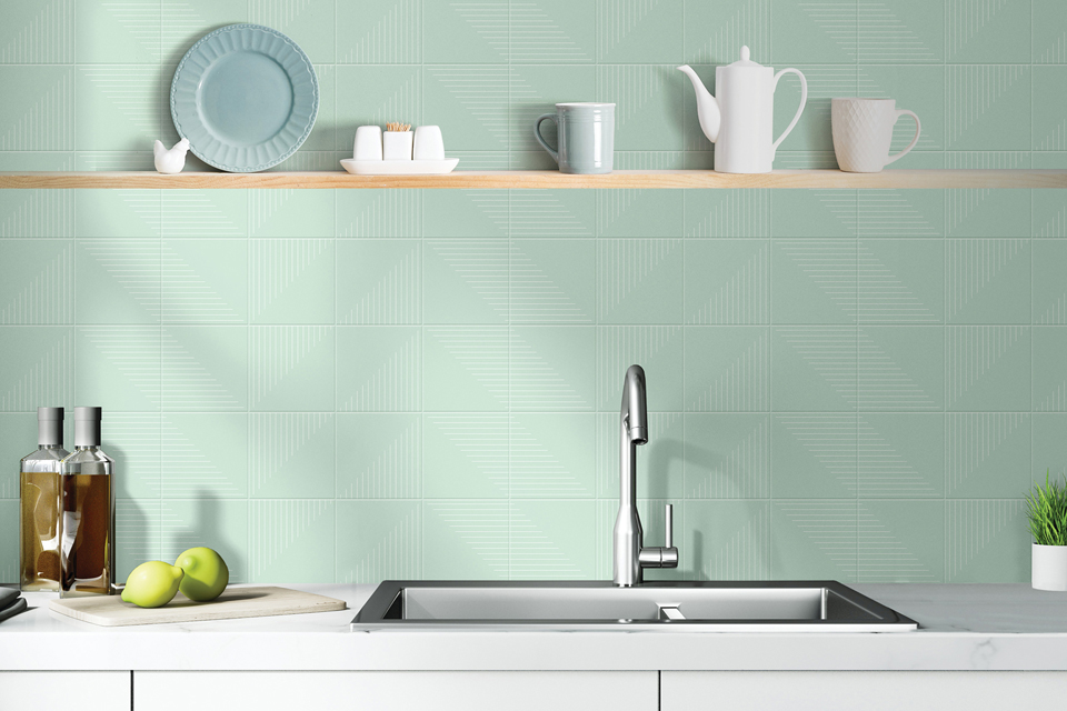 Daltile brand mint colored tile behind kitchen sink in the color confectionary