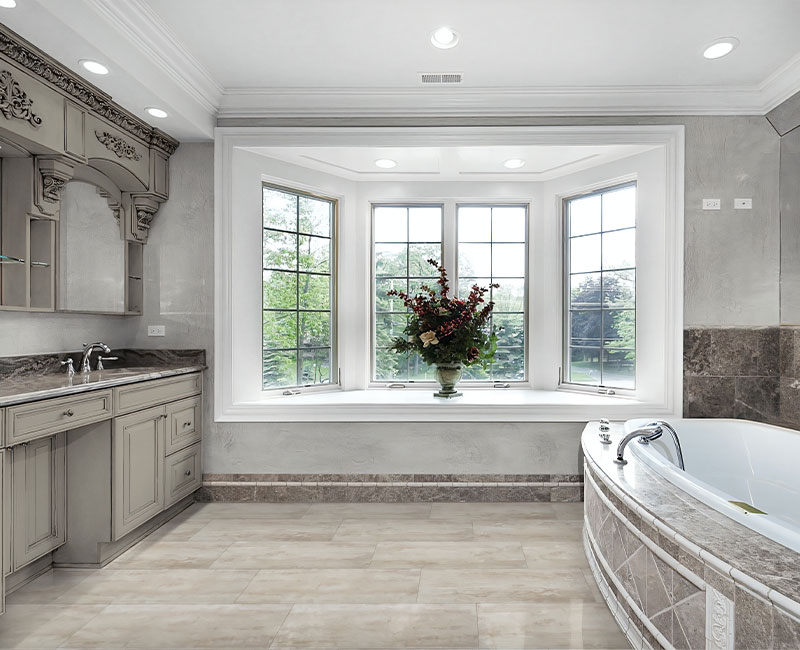 stone look luxury vinyl tile in bathroom with stone tile tub